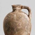 Close up of the weathered matte glaze texture of the rustic weathered ceramic vase.