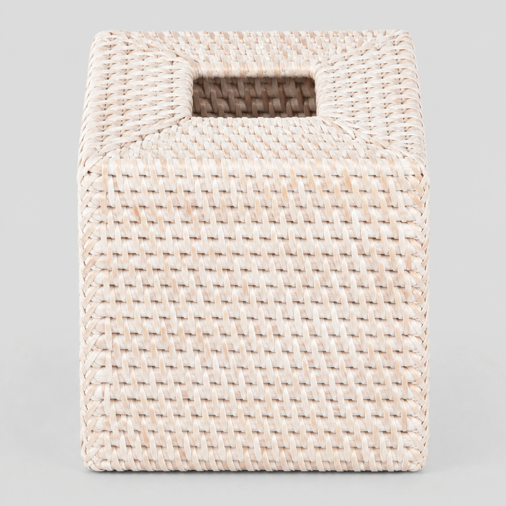 Woven rattan tissue box cover in Whitewash on a light gray studio background