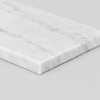 Close up of the straight bevelled rim of the rectangular marble tray in White Marble.