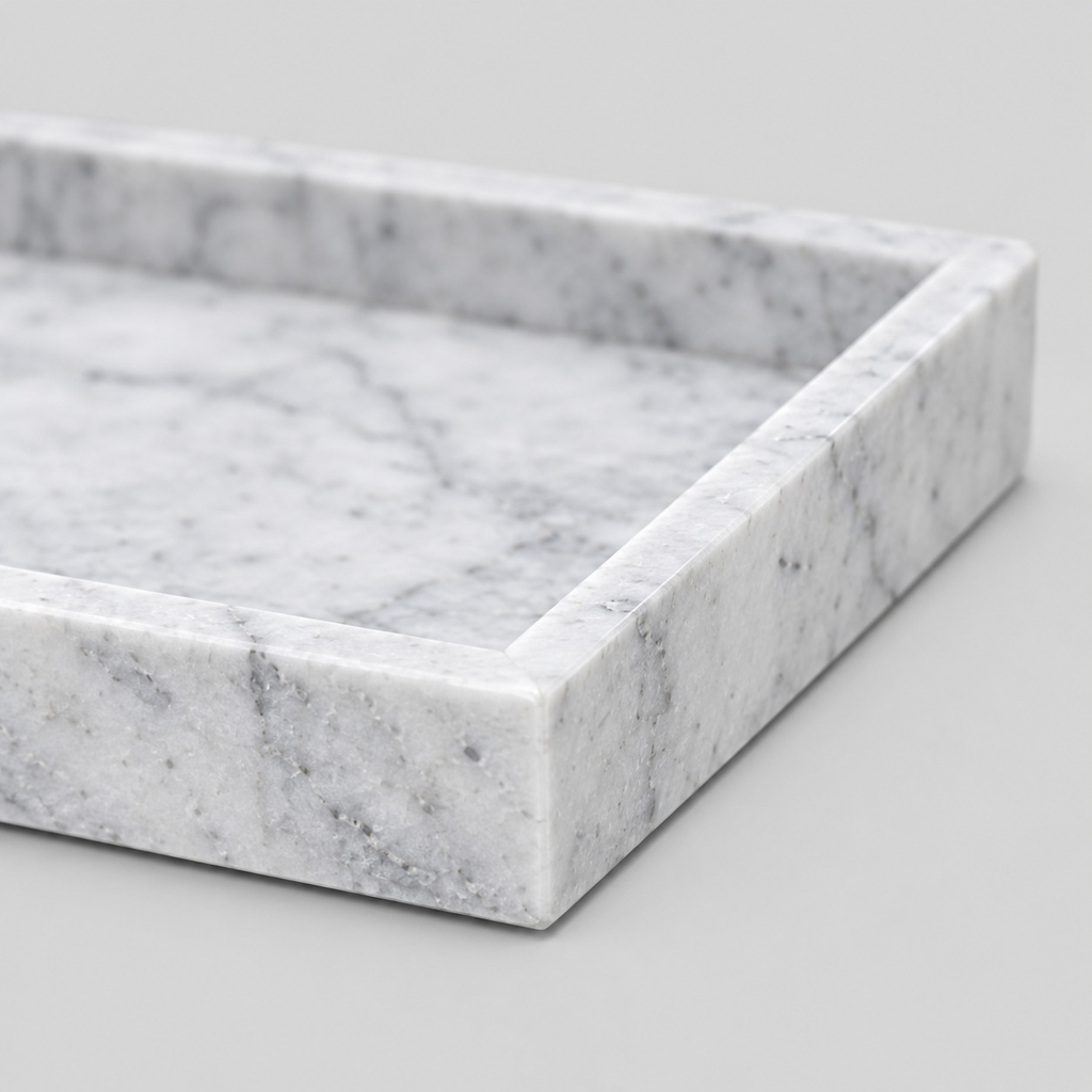 Close up of the raised rim along the border of the Cloud White rectangular marble vanity tray.