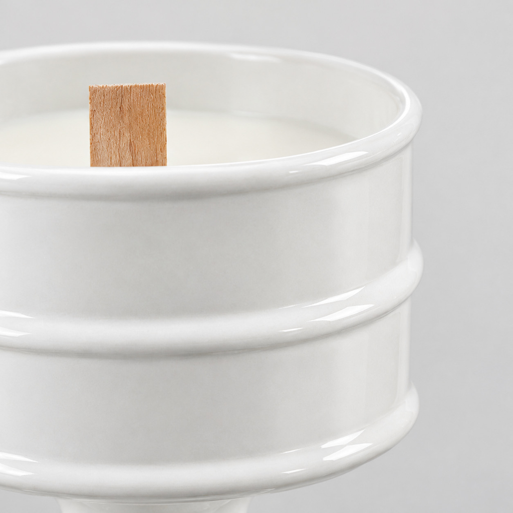 Close up of the smooth glazed rim of the Glossy White ceramic pedestal candle vessel.