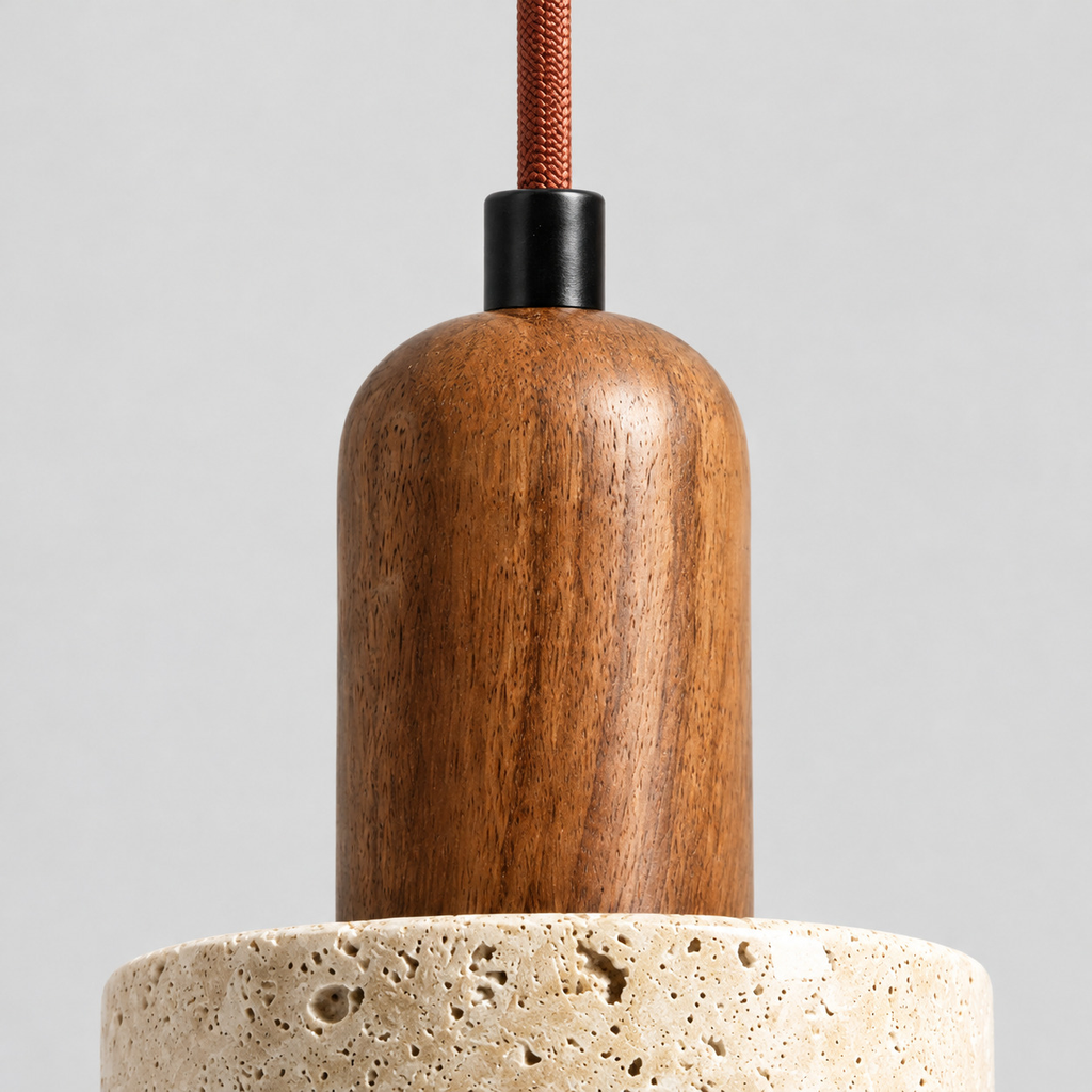Close up of the cord grip where the cord enters the base of the travertine pendant light