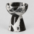 Pedestal marble candle holder in Black Marble on a light gray studio background.