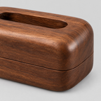 Close up of the smooth walnut wood grain surface texture of the curved wooden tissue box.