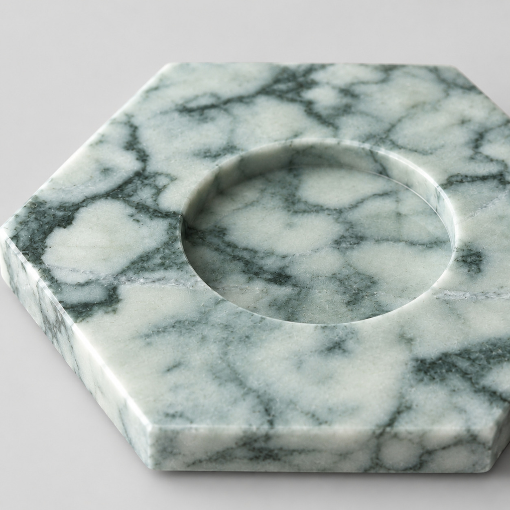 Close up of the polished surface texture and natural veining of the Green Marble candle holder.