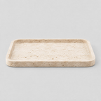 Rectangular travertine catchall tray in Beige Travertine on a light gray studio background.