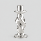 Silver twisted ceramic taper candle holder on a light gray studio background.