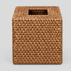 Brown square woven rattan tissue box cover on a light gray studio background.
