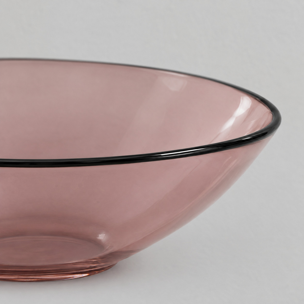 Close up of the contrasting black rim of the Blush shallow glass bowl.