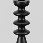 Close up of the sculpted disc accents along the turned column of the matte black turned beechwood taper candlestick