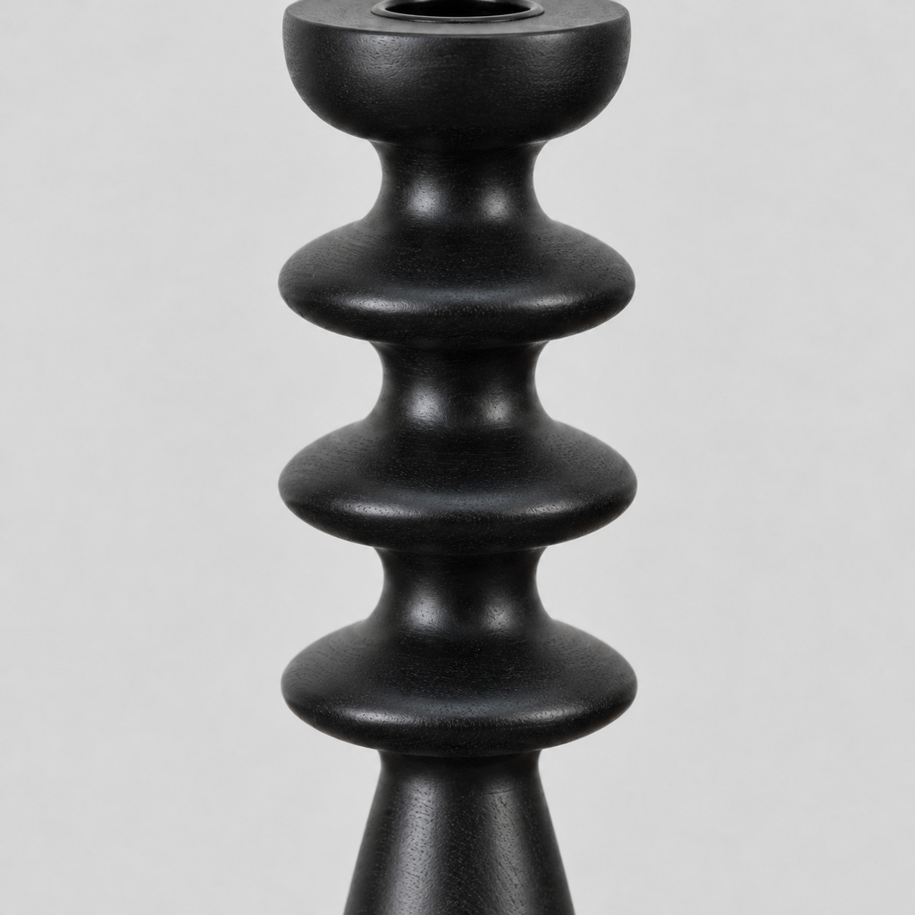 Close up of the sculpted disc accents along the turned column of the matte black turned beechwood taper candlestick