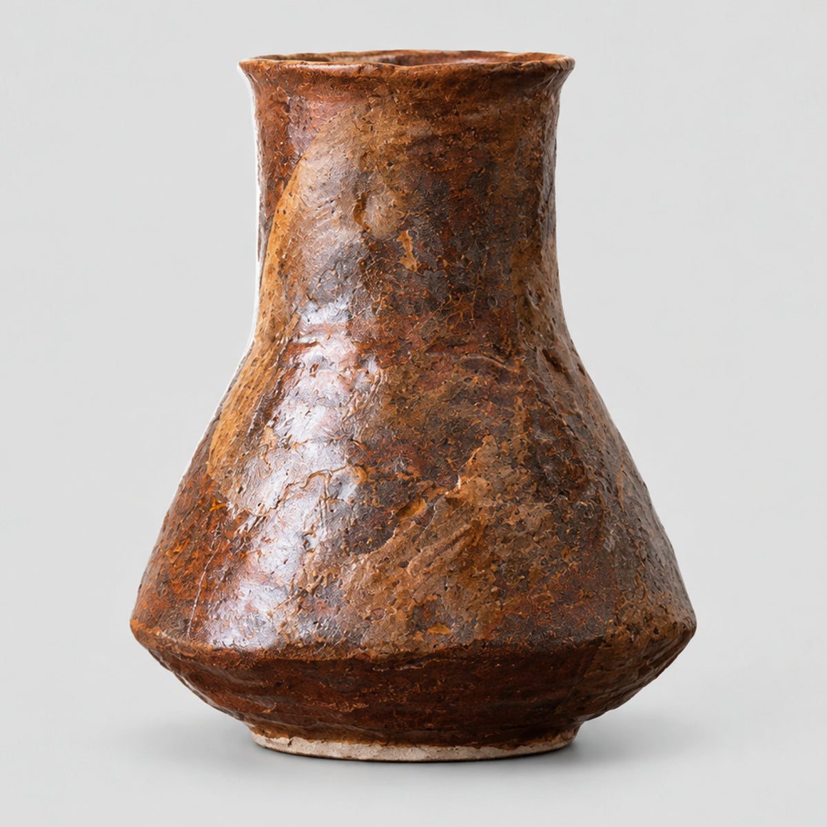 Coarse pottery bud vase in Rustic Brown on a light gray studio background.