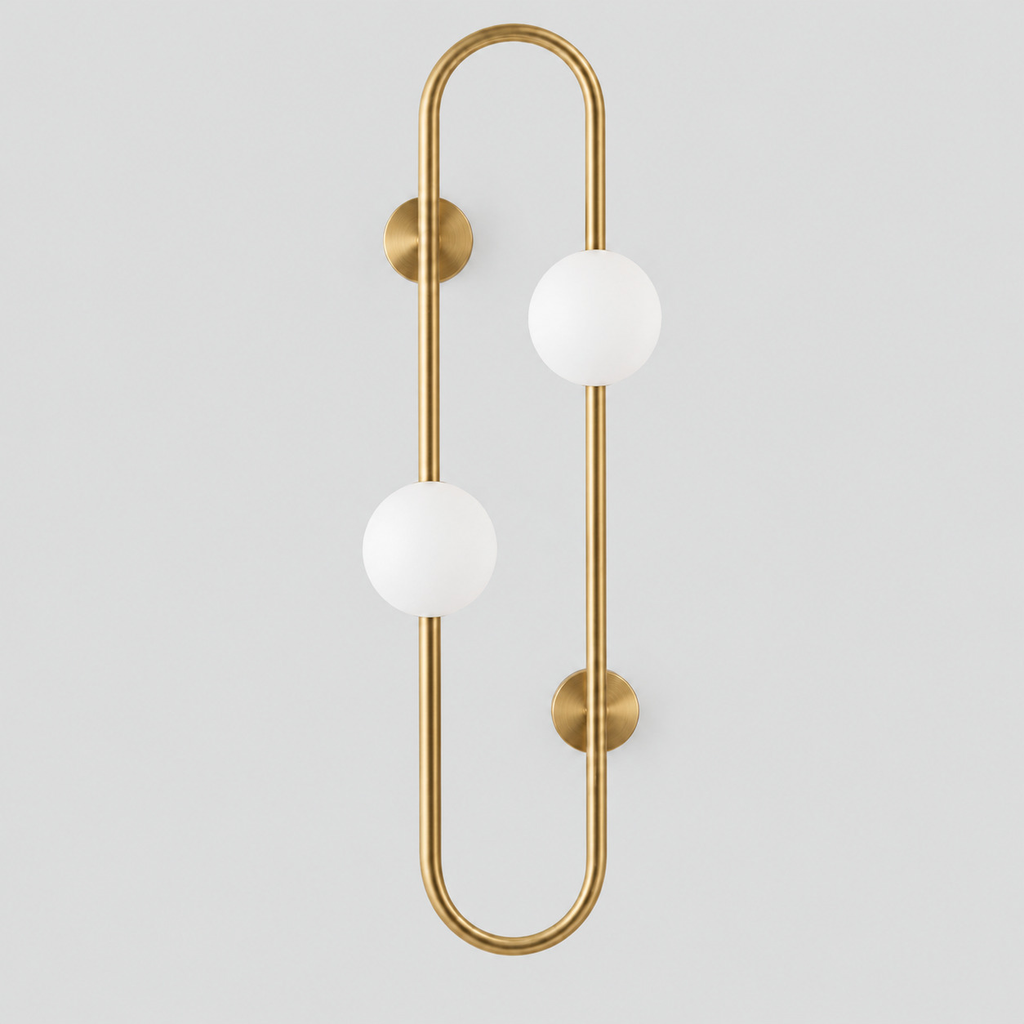 Brass pill-frame frosted globe wall sconce on a light gray studio background, in the 2 lights configuration