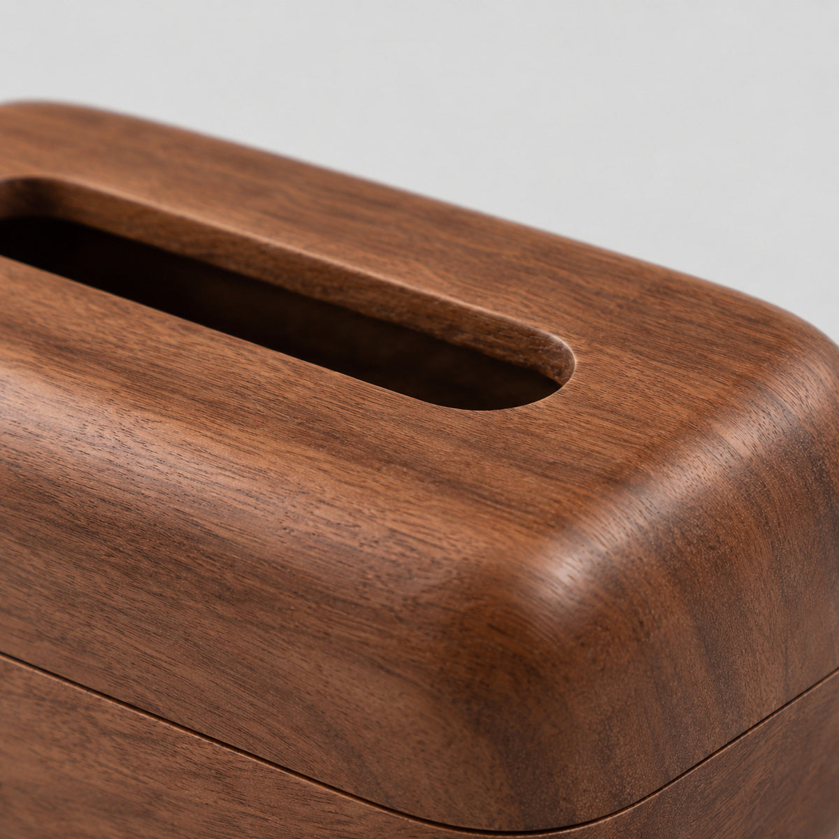 Close up of the smooth wood grain surface texture of the Walnut wooden tissue box.