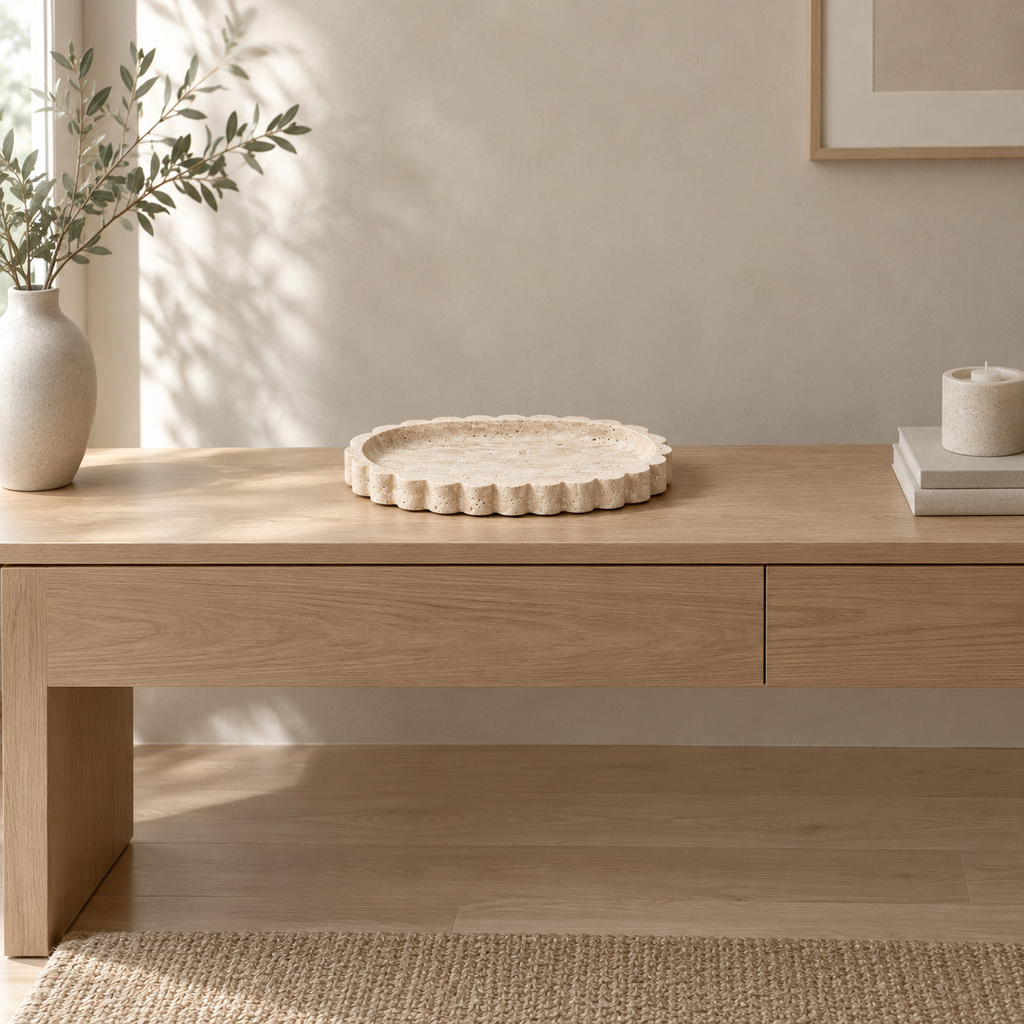 Scalloped oval travertine tray in Natural Travertine on an oak console table in a calm room