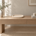 Scalloped oval travertine tray in Natural Travertine on an oak console table in a calm room