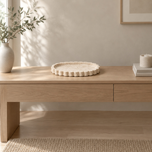 Scalloped oval travertine tray in Natural Travertine on an oak console table in a calm room