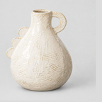 Off-white scalloped ceramic vase on a light gray studio background