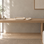 Oval travertine tray on a 120 cm wide oak console table in a calm room.