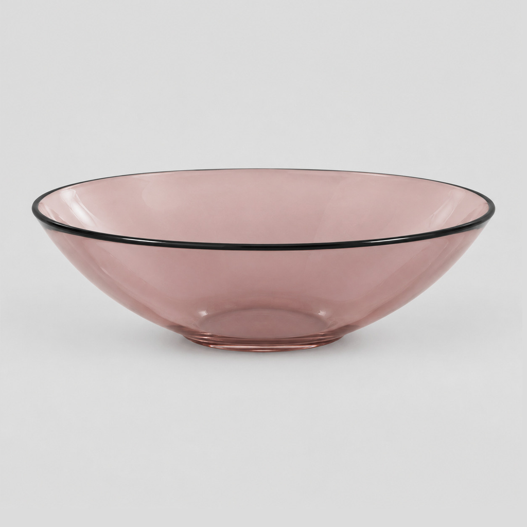 Shallow glass bowl with black rim in Blush on a light gray studio background.