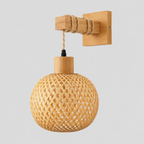 Natural wood woven bamboo wall sconce on a light gray studio background
