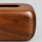 Close up of the joint or seam where the top meets the base on the curved solid wood tissue box cover in Walnut.