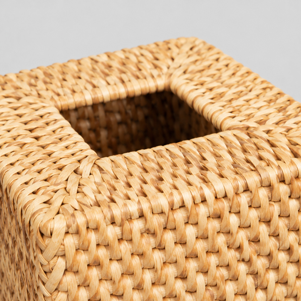 Close up of the braided rim around the top dispenser opening of the rattan tissue box cover.