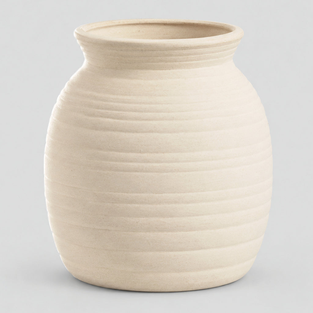 Off-white horizontally ribbed ceramic jar vase on a light gray studio background.