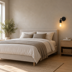 Matte Black knurled socket wall sconce lit beside a double bed against a plaster wall