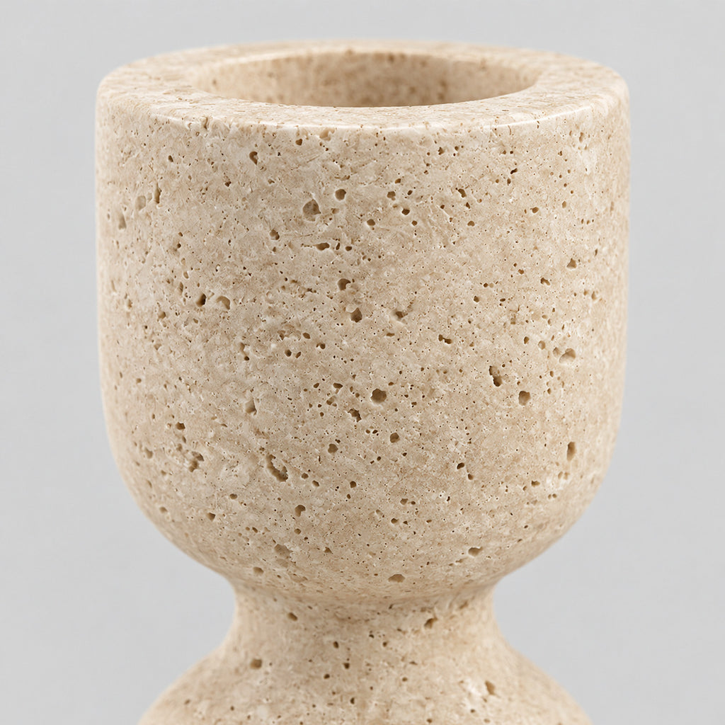 Close up of the porous stone surface texture of the travertine candle holder.