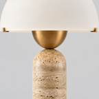 Close up of the brass socket cup holding the bulb seen from the side on the travertine dome table lamp