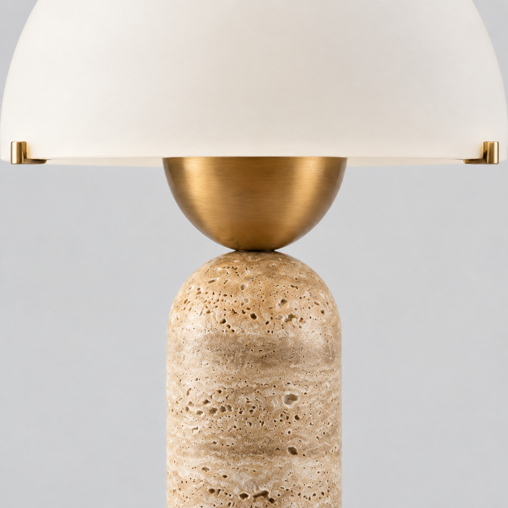 Close up of the brass socket cup holding the bulb seen from the side on the travertine dome table lamp