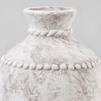 Close up of the embossed beaded band on the rustic textured ceramic urn vase