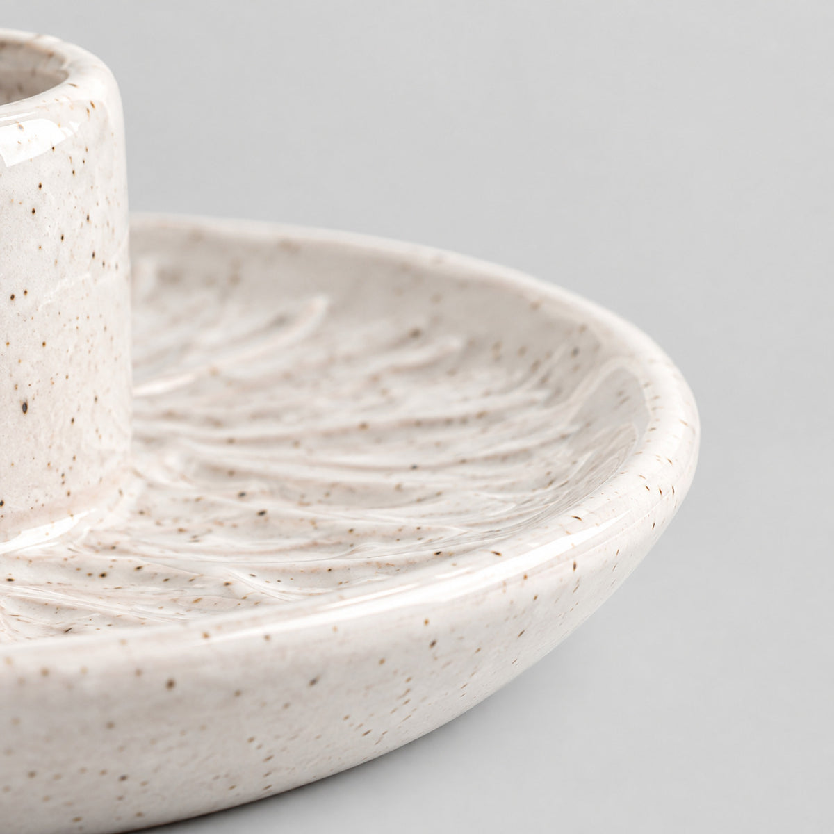 Close up of the smooth rounded rim of the Speckled White ceramic incense dish
