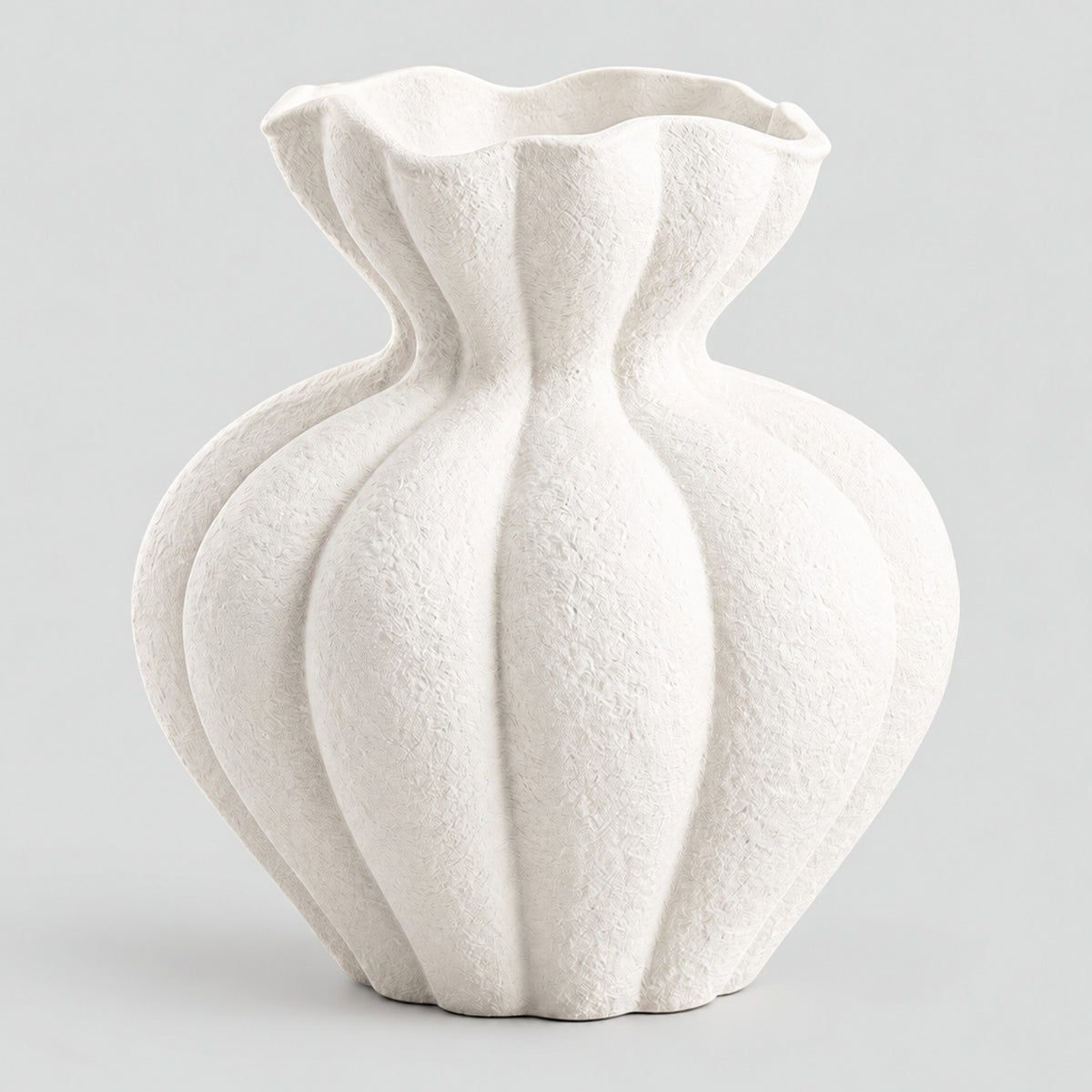 Textured matte white ceramic vase in Matte White on a light gray studio background, in its French Large shape