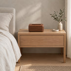 Walnut wooden tissue box on an oak bedside table in a calm bedroom.