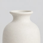Close up of the tapered rim at the bottle neck of the Off-White matte ceramic bud vase.