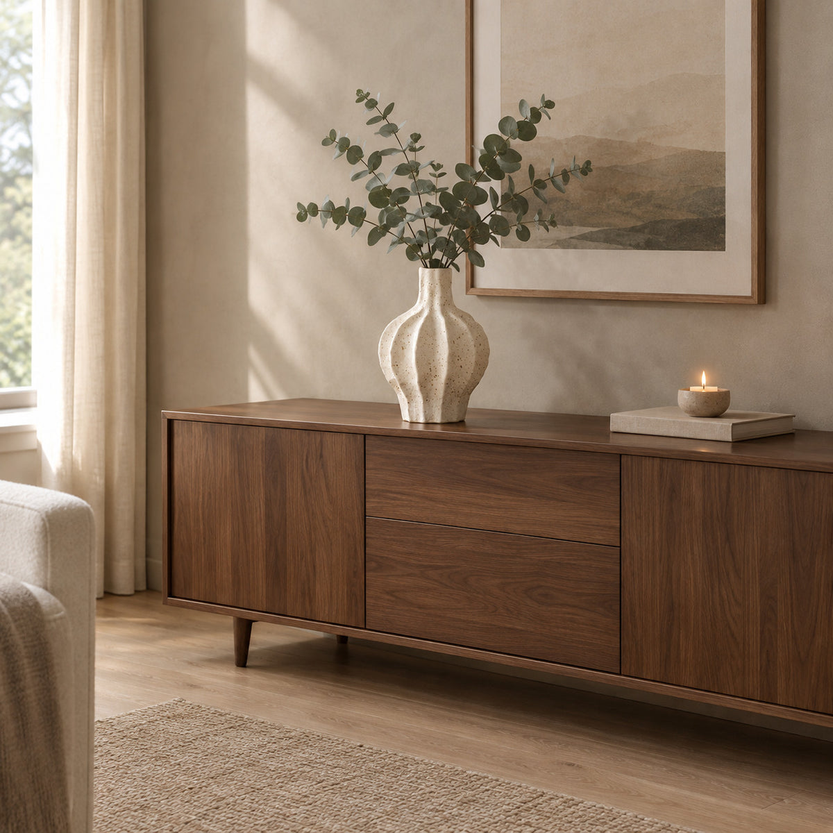 Coarse ceramic fluted vase in Speckled White on a walnut sideboard styled with eucalyptus stems.
