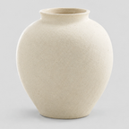Textured round ceramic vase in an Off-White finish on a light gray studio background