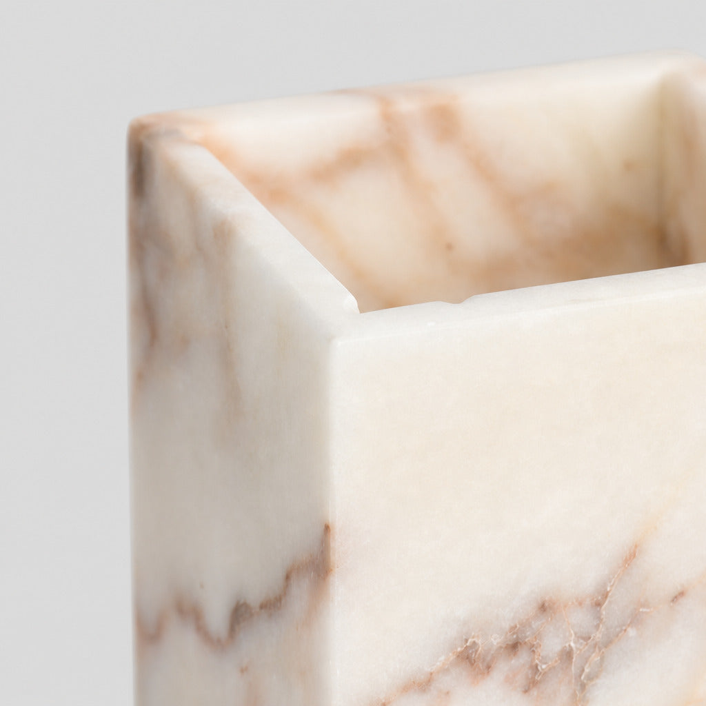 Close up of the beveled square rim of the square marble candle holder.