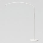 Matte White arched LED floor lamp on a light gray studio background