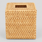 Natural woven rattan cube tissue box cover on a light gray studio background