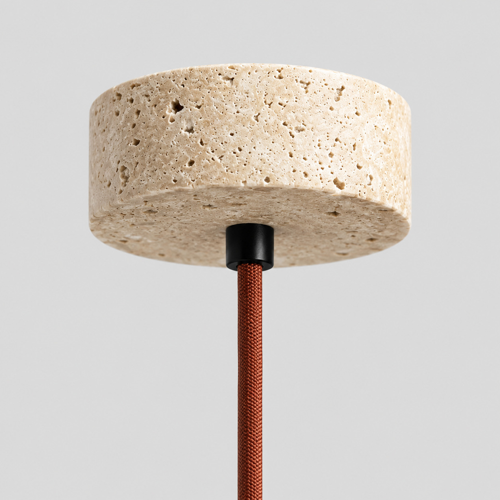 Close up of the round canopy against the wall of the travertine pendant light