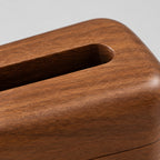 Close up of the smooth walnut wood grain surface texture of the rounded wooden tissue box cover in Walnut.