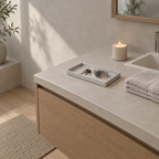 Speckled ceramic catchall tray in Speckled White on a 90 cm wide bathroom vanity beside a folded towel with a set of keys and a watch on the tray.