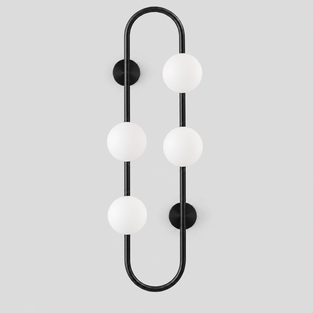 Matte Black pill-frame frosted globe wall sconce on a light gray studio background.