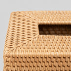 Close up of the braided rim at the top opening of the woven rattan tissue box cover