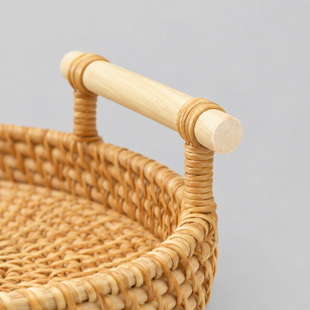 Close up of the wooden handle wrapped with rattan of the round woven rattan serving tray.