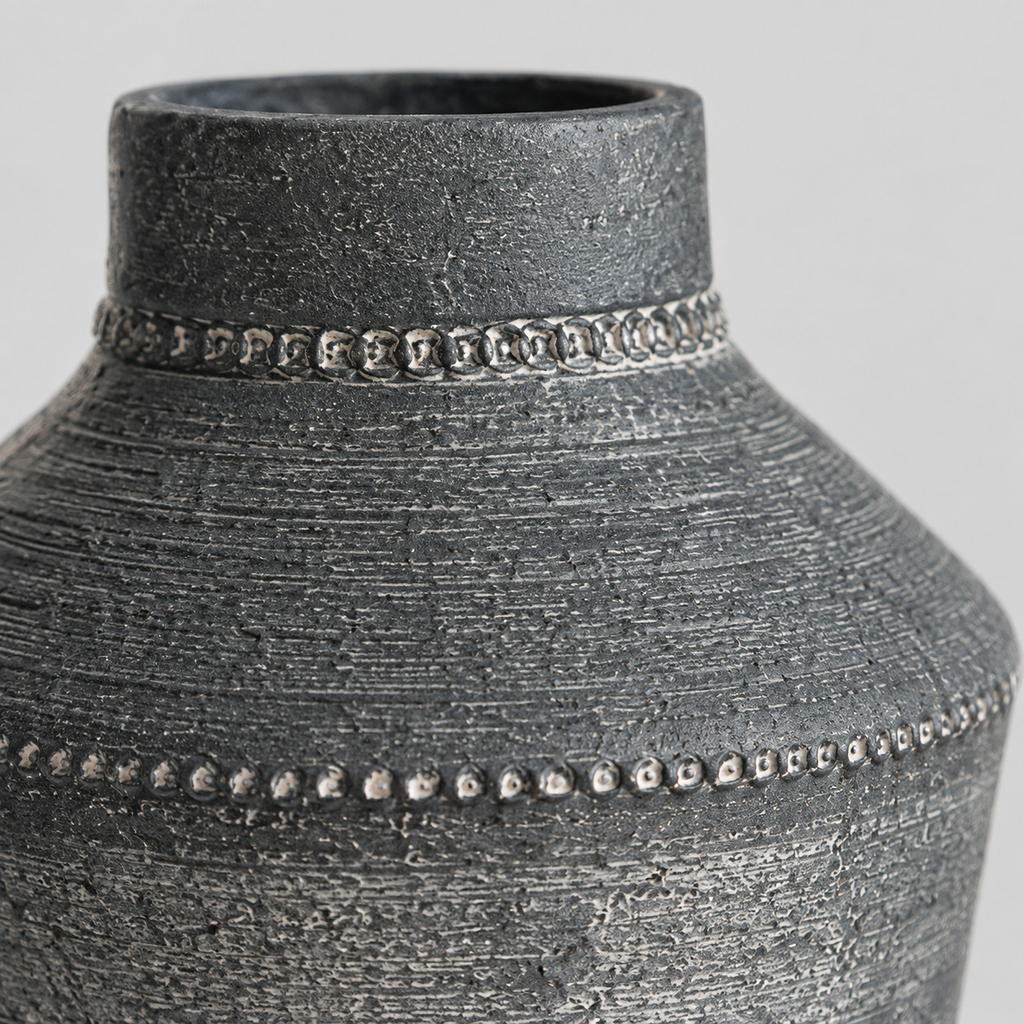 Close up of the embossed beaded pattern around the shoulder of the Antique Gray textured ceramic urn vase.