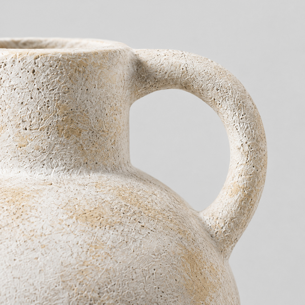 Close up of the curved ceramic handle where it joins the neck of the Vintage Beige ceramic pitcher vase